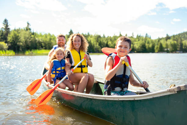 A Family in a Canoe on a Lake having fun